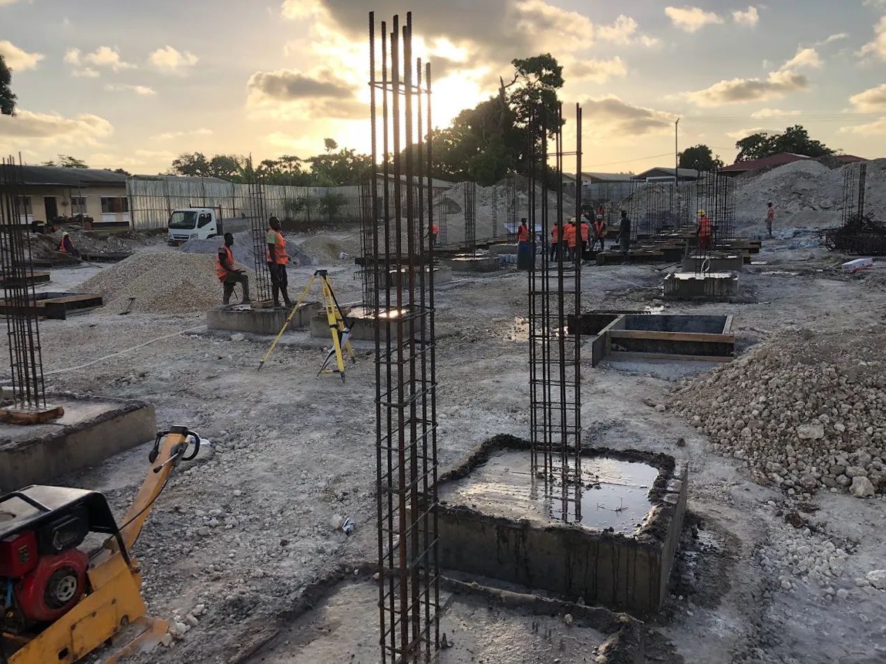 Benchmark Engineering team on site at golden hour — active foundation work